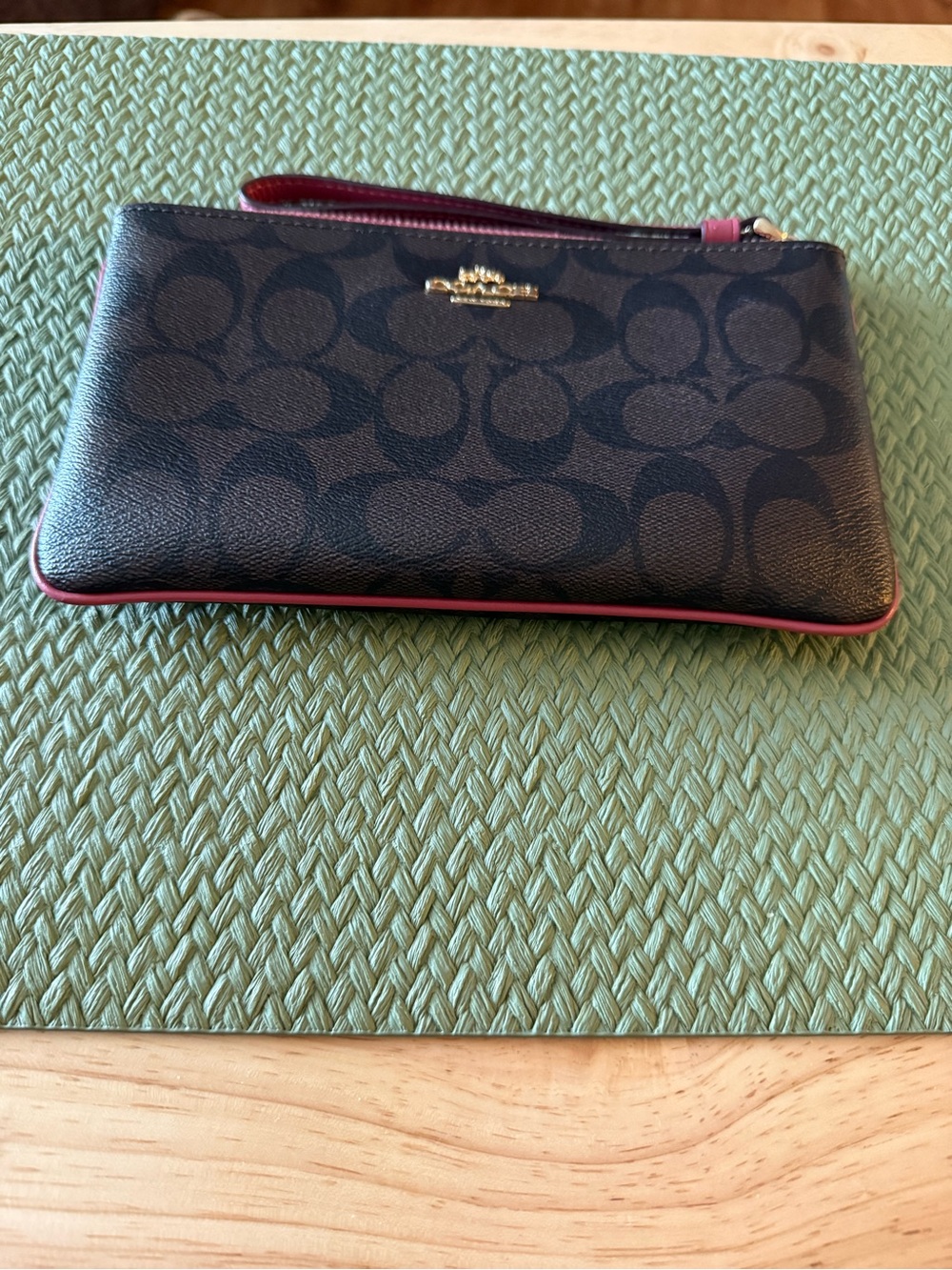 Coach Brown Signature Wristlet with Pink Trim and Gold Logo